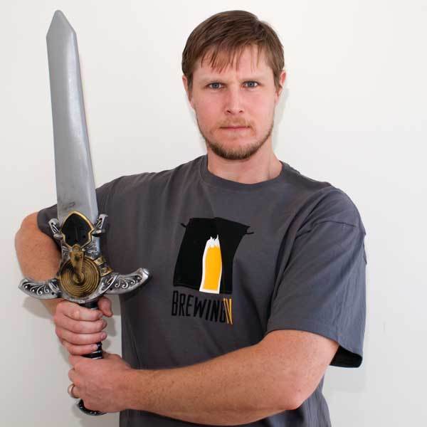 A cool homebrewer brandishing a fancy sword wearing the Brewing TV shirt