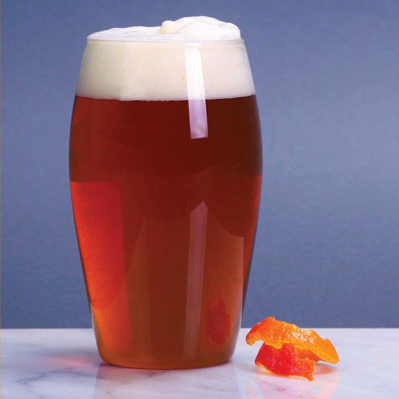 Grapefruit Pulpin in a glass beside some grapefruit pulp